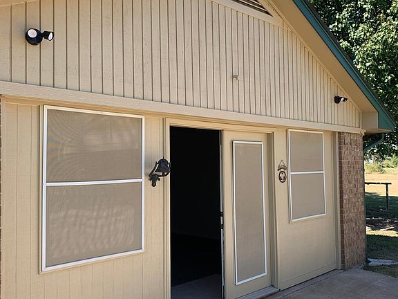 The front of the added on addition - may have originally been a garage.