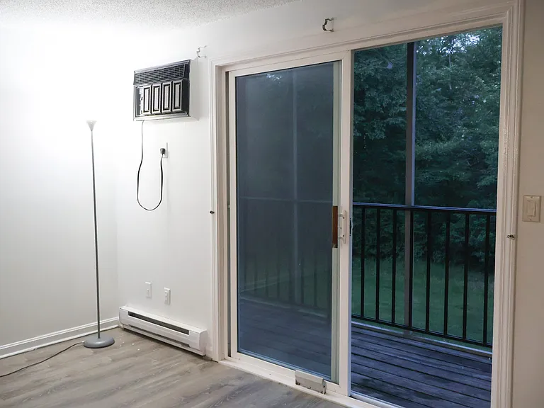 Living Room / Living Space _ Renovations Nearing Completion. New Baseboards Will Be Installed and the Fire Escape Door Will Be Freshly Painted.