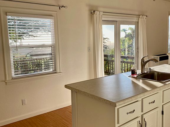 Kitchen with view and sliding door to the deck