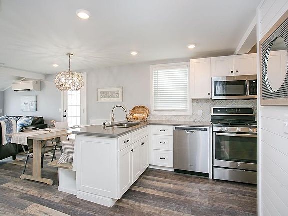 Stainless steel appliances, recessed lighting and two mini splits (one of each floor)