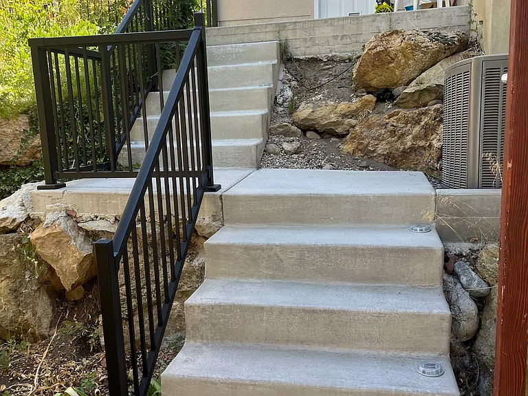 Stairs in backyard to access the basement apartment.