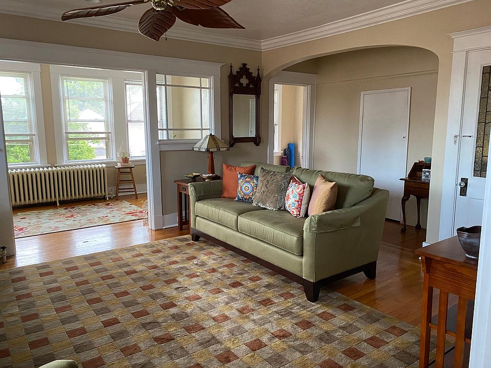 Living room flows into the sunroom.
Door to the right of the sunroom is an additional area perfect for a home office!