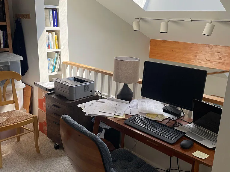 Desk and skylight in loft.