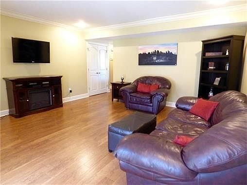 Spacious living room with beautiful hardwood floors1