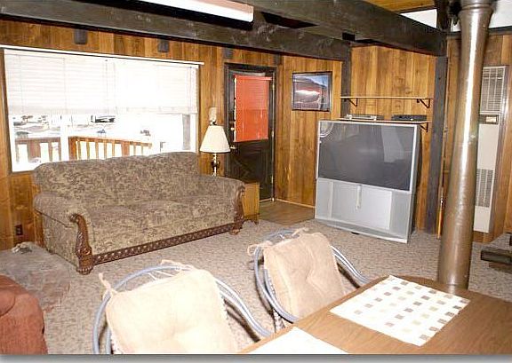 Downstairs is the living room, kitchen, and a bedroom that today is a computer