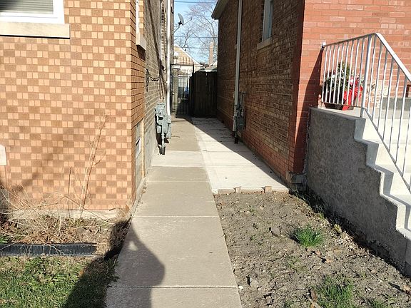 2nd image of 7131 S Mozart St #1REAR