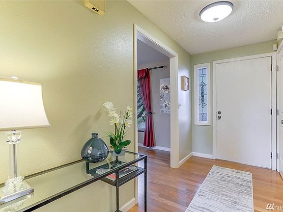 Enjoy this sunny entry with hardwoods sweeping through the main level.