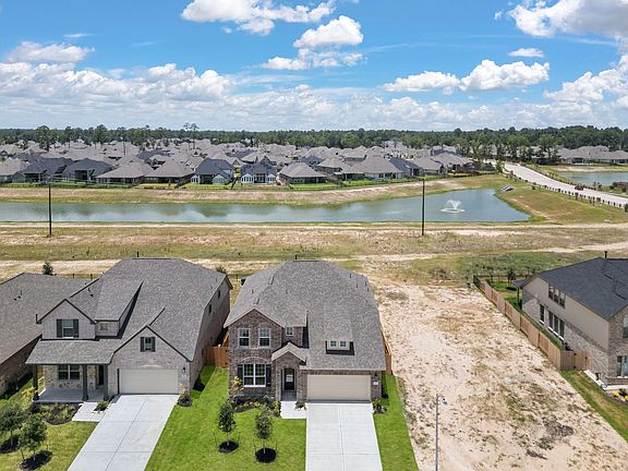 An additional view of your home, lot and neighborhood including a private lake view