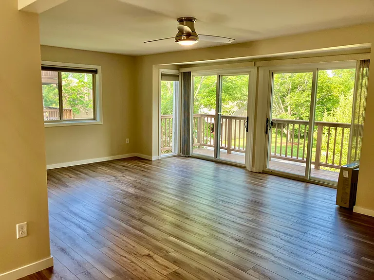 Living room with sliders out to deck
