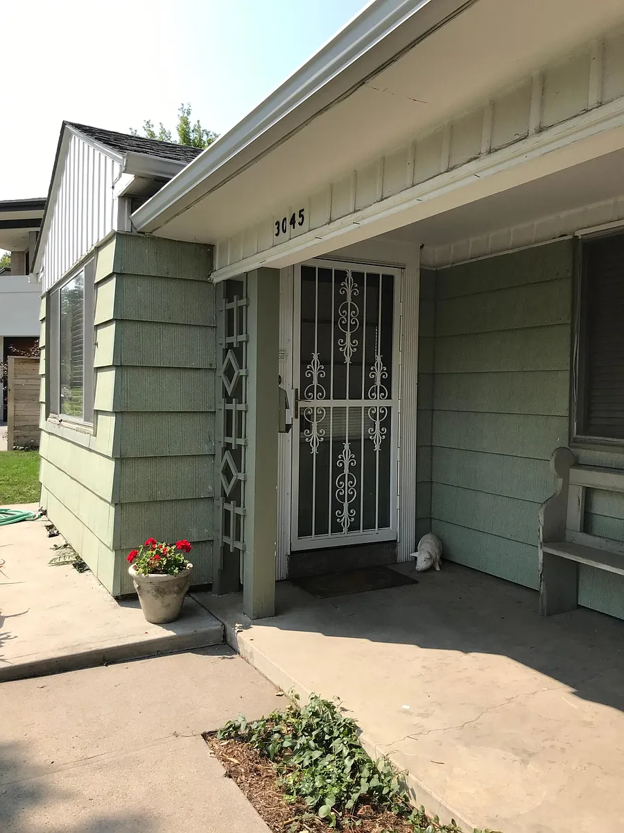 Front entry with security door. - 3045 S Birch St