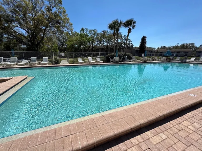 SUNNYBROOK IS A VIBRANT GATED COMMUNITY THAT FEATURES A YEAR-ROUND HEATED POOL, HOT TUB, TENNIS AND PICKLEBALL COURTS, BOCCE BALL, SHUFFLEBOARD, AND A COMMUNITY COMMUNITY ROOM WITH POOL TABLES AND SCHEDULED EVENTS AND ACTVITIES.