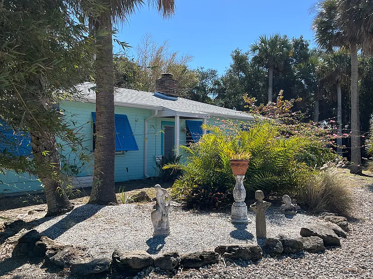 Quaint charming beachside cottage on a corner with direct street beach access.