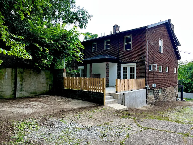 Designated parking pad for two cars. Featuring back patio perfect for barbecue hang out.