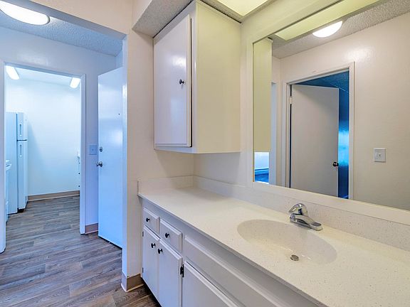 Bathroom with generous vanity space and contemporary features.