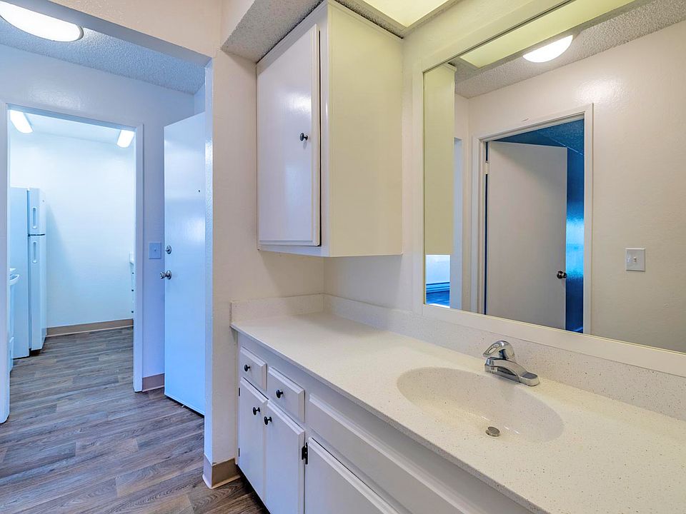 Bathroom with generous vanity space and contemporary features.