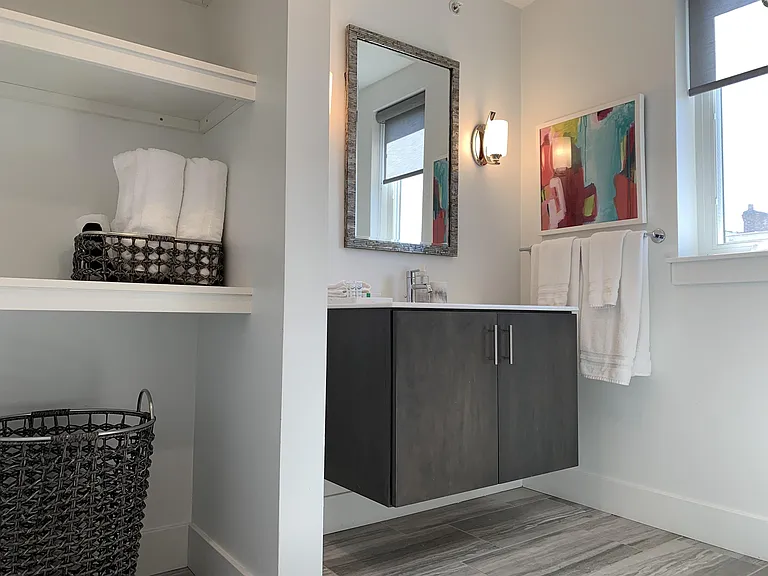 The second floor bathroom is shared by bedrooms 2 & 3. It's large and designed to impress.