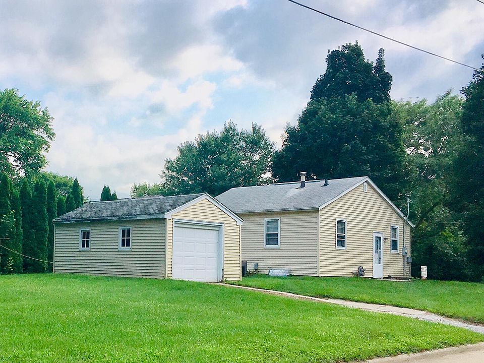 Street view of house and detached garage