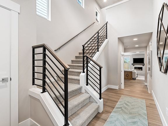 Two-story entry with horizontal open rail at the stairway