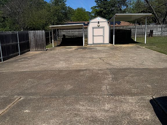 Backyard Shed area with covered parking area away from the house.