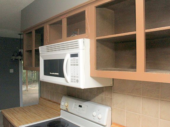 Open roomy cabinets. Can leave as is or redo.