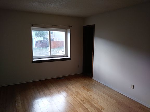 Comfy Master Bedroom with wood floors