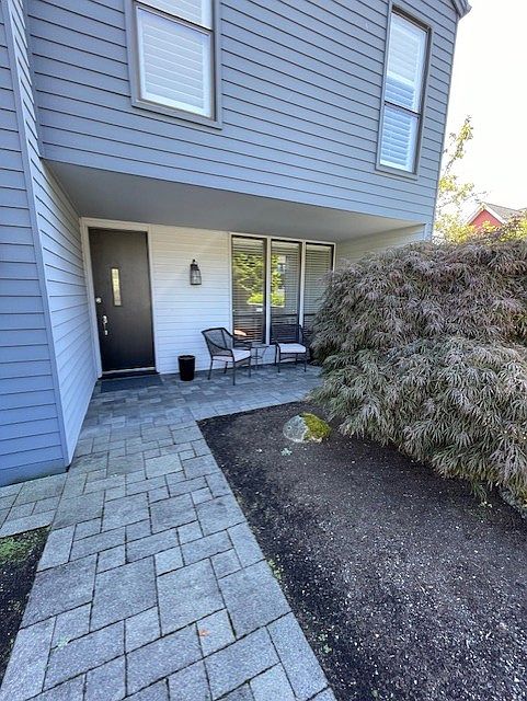 Welcome landscaped courtyard entry.