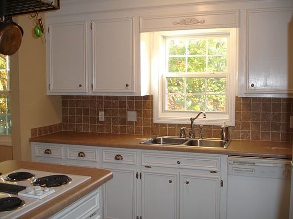 New countertops, tile, paint, hardware, lights and GE Profile Cooktop