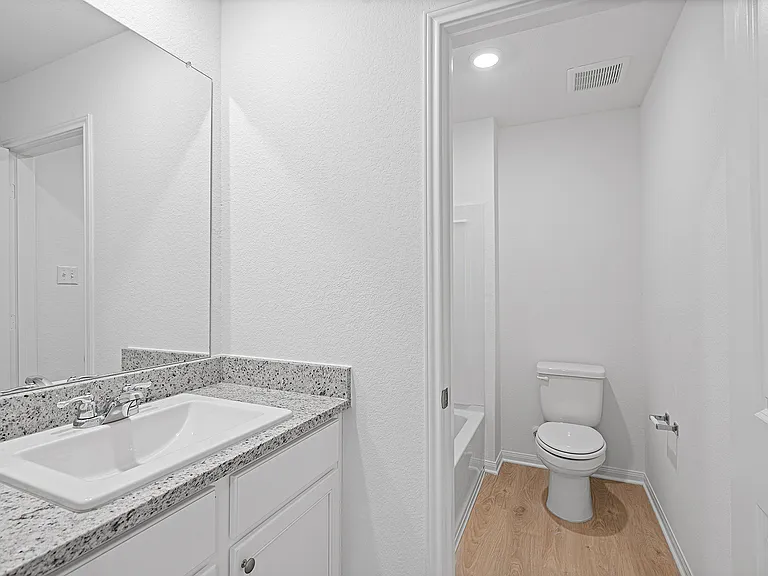 Additional bathroom located upstairs.
