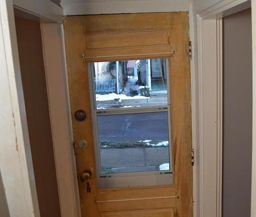 Front door with original doorbell