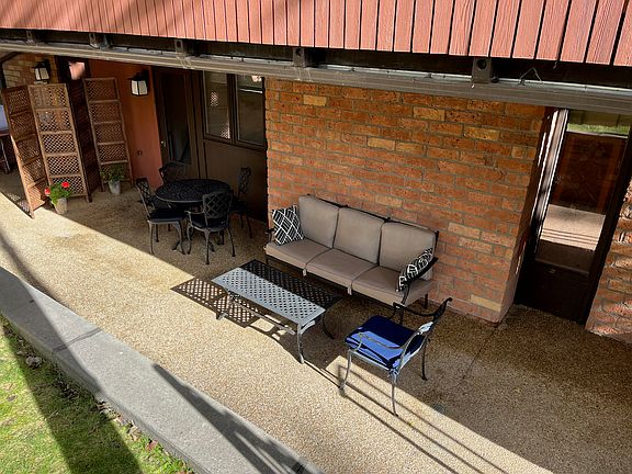 Large outdoor garden-level patio just down stairs from building entrance.