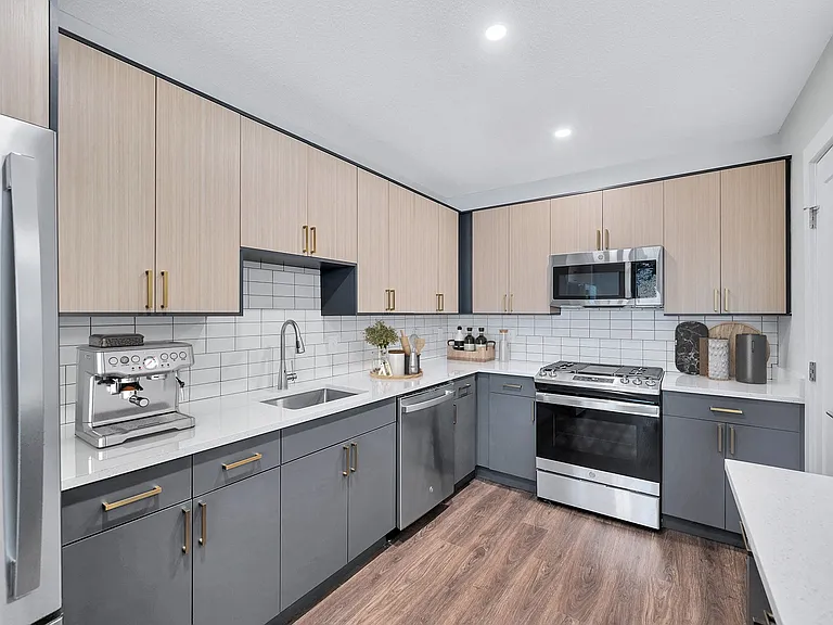Gourmet designer kitchens with tile backsplash and gold finishes