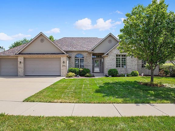 Garage is 4 cars (3 wide with 1 tandem).  Radiant floor heat plus separate furnace/AC, walk up stair