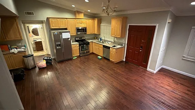 Expansive main level featuring a fluid, open-concept layout connecting the kitchen, dining, and primary living spaces.