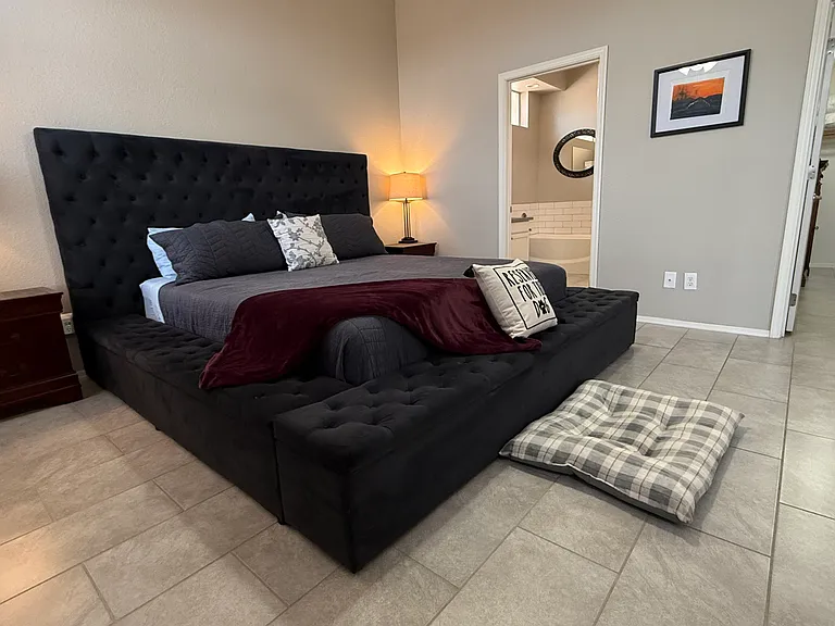 Master Bedroom. California King size bed shown. Spacious walk-in closet, and master bath.