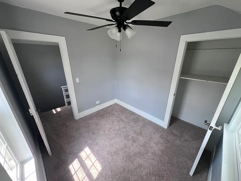 upstairs bedroom at top of steps