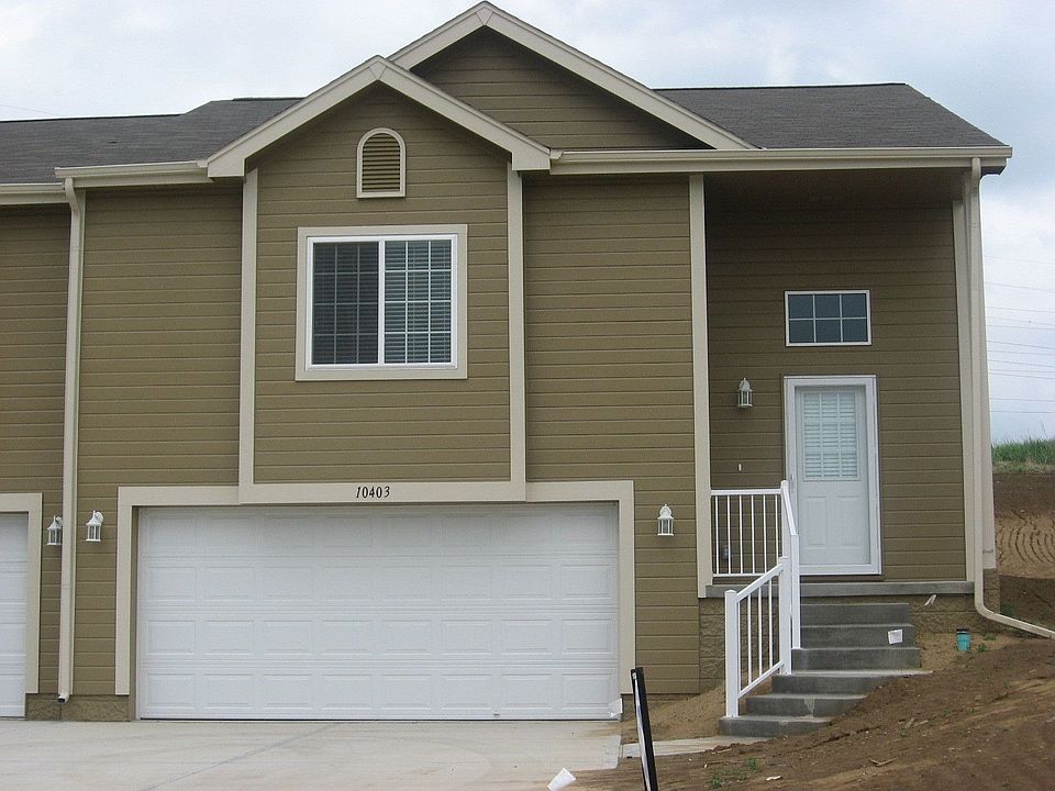 The house before grass was put in.  The yard now has grass and 2 trees