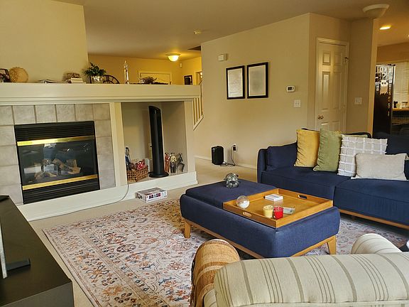 Family room has a cozy gas fireplace.