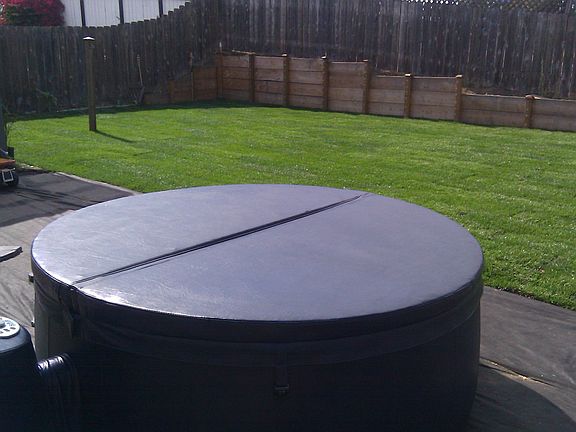 Beautiful backyard lawn and patio (Hot tub is gone sorry)