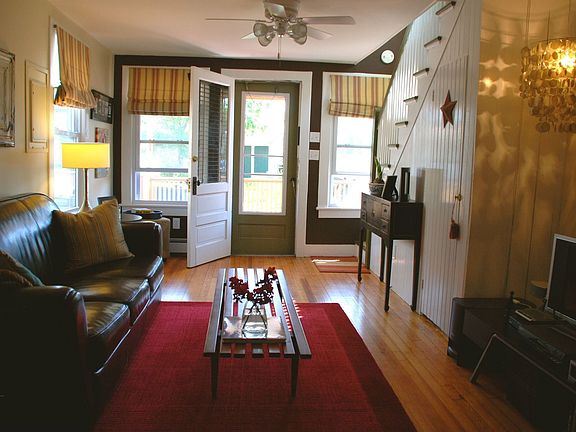 Through the front door to a charming living room. 