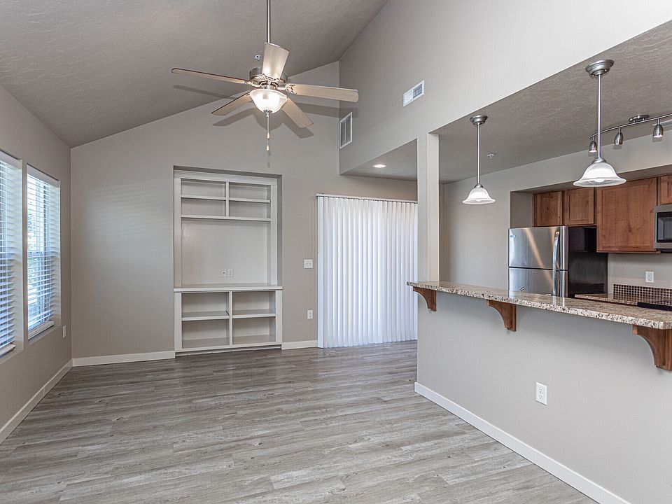 Open living room with a built in media center.