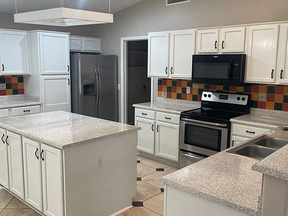 Kitchen with granite countertops and stainless steel appliances