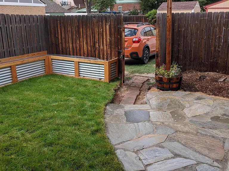 Shared backyard patio and garden beds