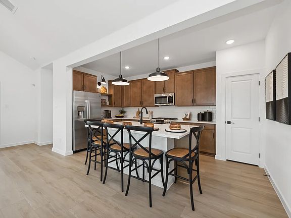 Kitchen with pendant lighting and gorgeous countertops