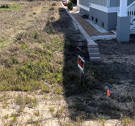 View from back of lot marking RIGHT DUNE FLAG