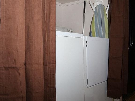 Inside laundry with full size washer/dryer