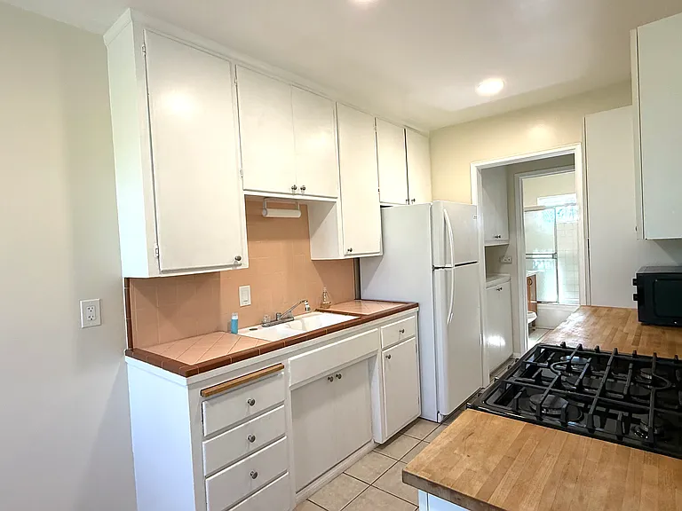 Kitchen with original tile details.