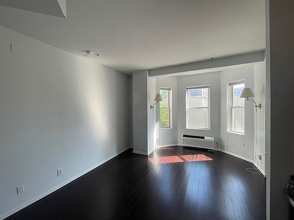 Living Room, left was is painted with special paint ideal for projectors to make the wall a massive movie screen