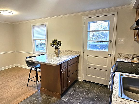 Kitchen & dining area with access to backyard