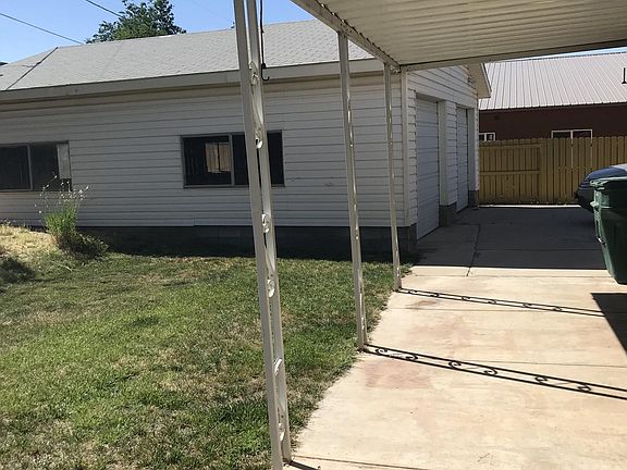back deck with detached 2 car garage