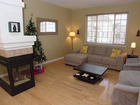 Living room with 3 sided fireplace